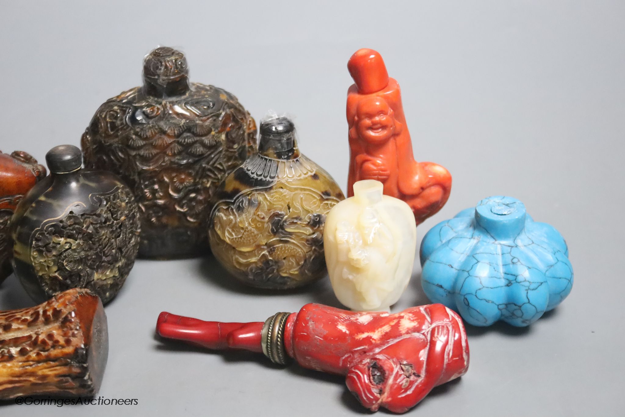 A collection of Chinese eleven horn and mother of pearl snuff bottles